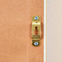 Brass door handle on a wooden door