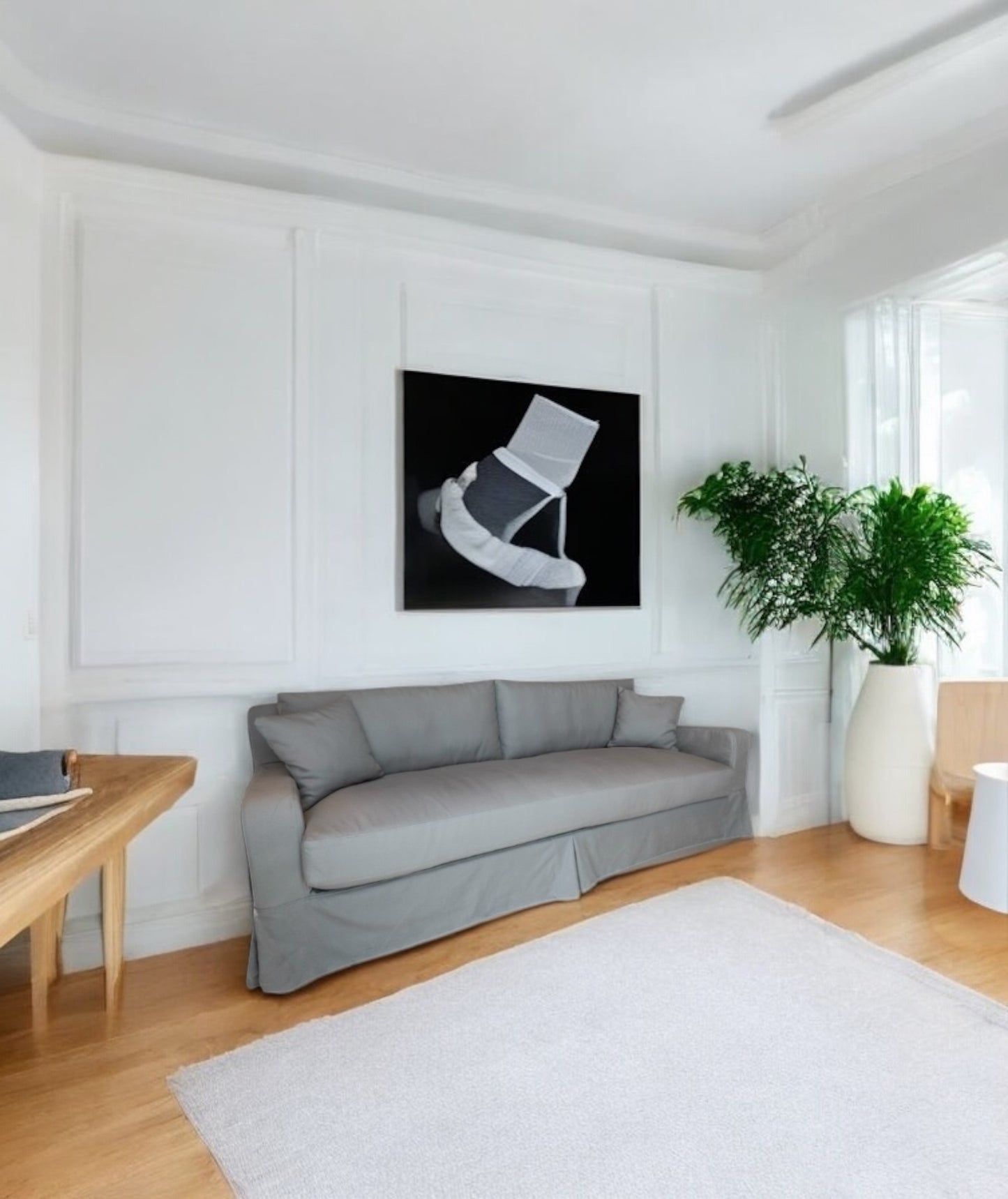 Modern living room with gray sofa, wooden coffee table, and abstract art on the wall. Dubai Collection Sofa – Timeless Comfort & Elegance | Vella Concept