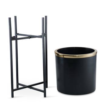 Black metal plant stand with a black planter on a white background