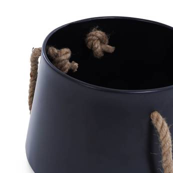 Black bucket with rope handles on a white background
