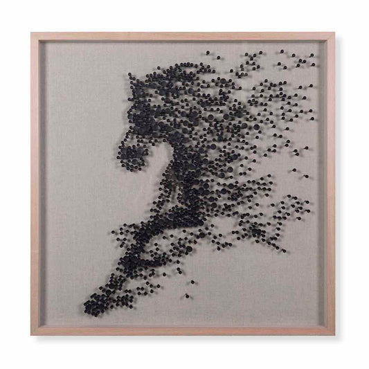 Framed artwork of a running person made from small black dots on a gray background