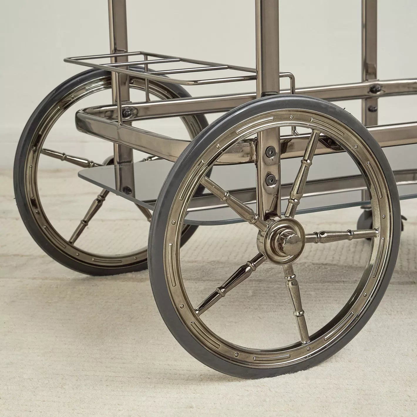 Close-up of a wheelchair with large wheels on a light background- Notica Serving Trolley - Metal & Glass 81cm
