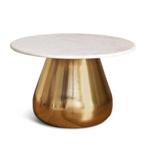 Round table with marble top and brass base on a white background