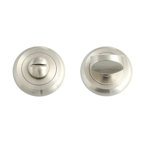 The Living room door zinc escutcheon features two round brushed metal components: a thumbturn on the right and a key slot on the left, designed for spindle installation and secured to the door with wood screws.