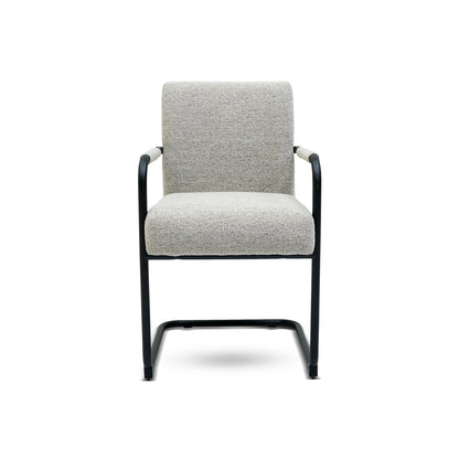 Gray upholstered chair with black metal frame on a white background