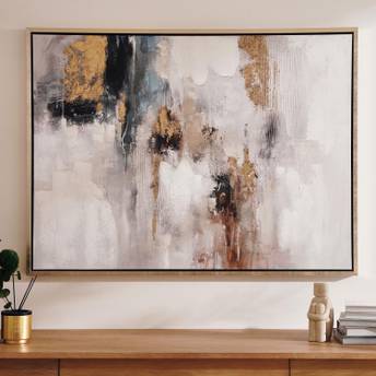 Abstract art painting on a wall above a wooden console table.
