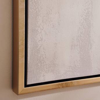 Framed artwork with a gold border on a beige wall