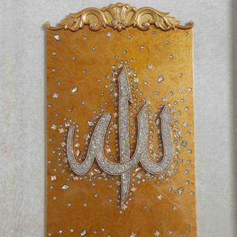 Decorative wall art with gold and silver design on a beige background