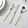 Set of silverware with gold accents on a white background- Arabia 24-Piece Cutlery Set – Stainless Steel