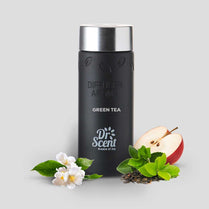 Black diffuser aroma bottle labeled 'Green Tea' by Dr. Scent with apple and leaves on a light gray background