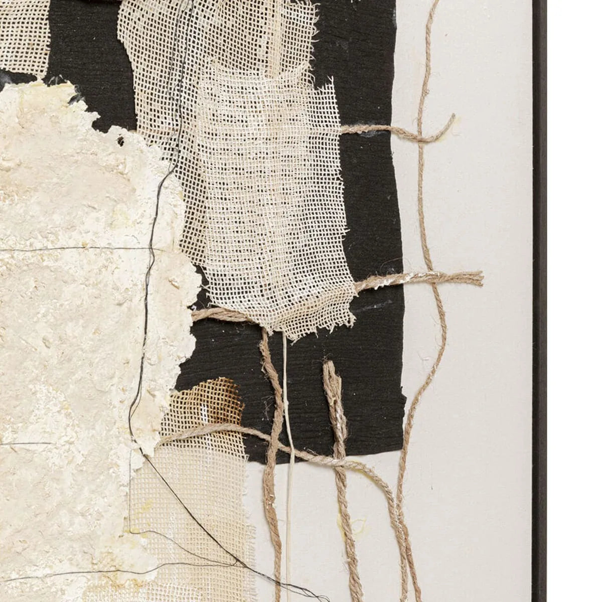 Textured fabric with black, white, and beige patterns on a white background