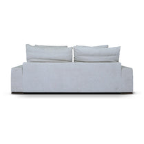 Light gray sofa with three cushions on a white background