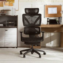 Black mesh office chair in a home office setting with a desk and cabinets.