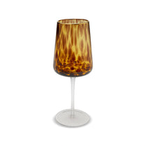 Wine glass with tortoiseshell pattern on a white background