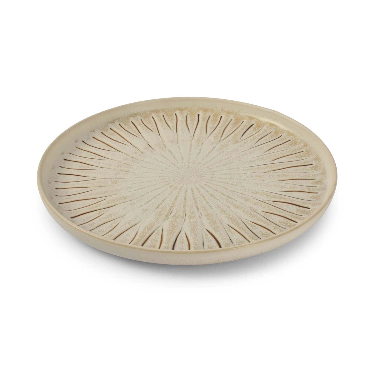 Round ceramic plate with radial design on a white background