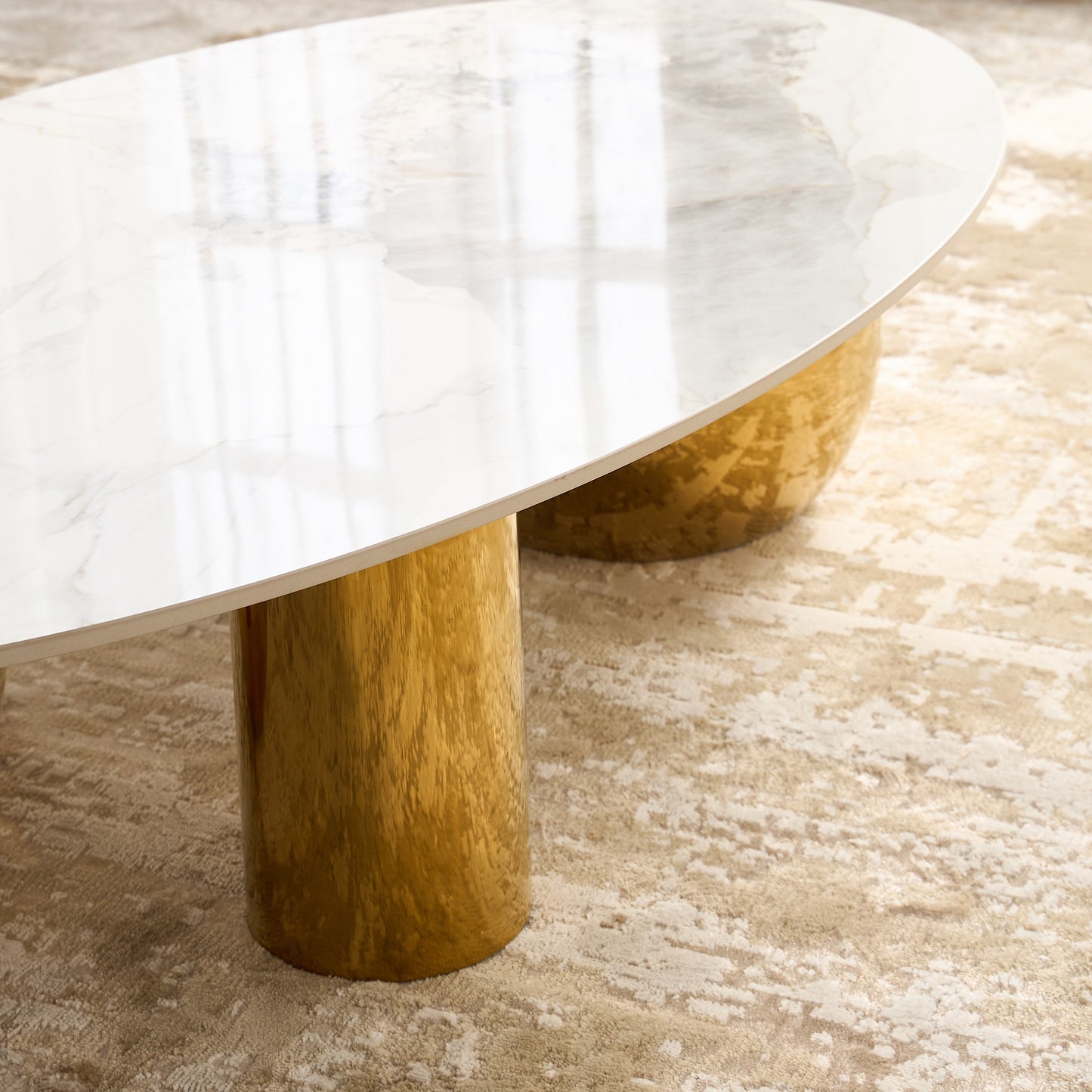 Marble table with wooden legs on a textured floor