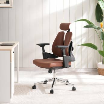 Brown office chair with headrest in a room with a desk and plant