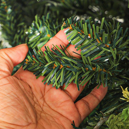 Close-up of a hand holding artificial greenery
