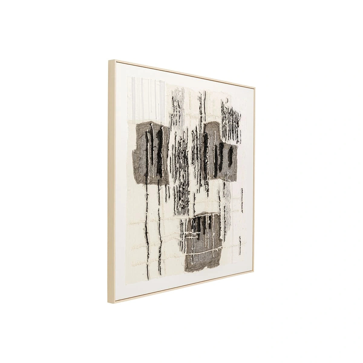 Abstract art piece with black and white patterns in a gold frame on a white background