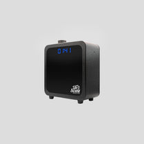 Black electronic device with digital display on a gray background