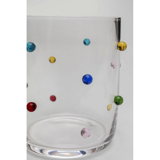 Clear glass with multicolored dots on a white background