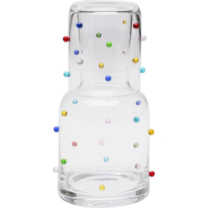 Clear glass bottle with multicolored beads on a white background
