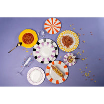 Colorful plates with different patterns on a purple background