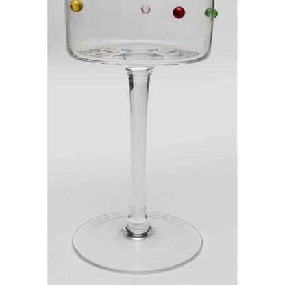 Clear glass with colorful beads on a white background