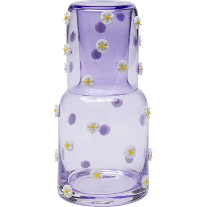 Glass vase with floral decorations on a white background