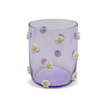 Lavender glass vase with white daisy flowers on a white background