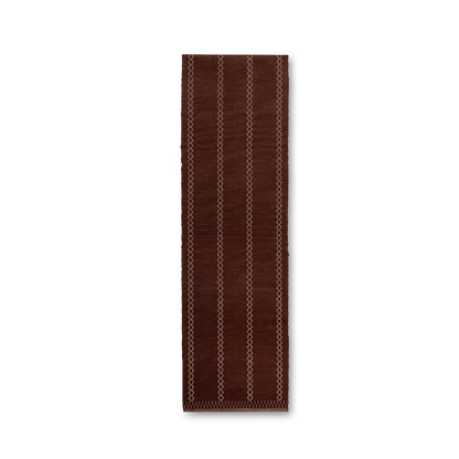 Brown runner rug with geometric pattern on a white background