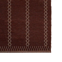 Brown rug with geometric pattern on a white background