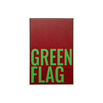 Red sign with green text 'GREEN FLAG' on a white background