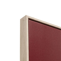 Close-up of a wooden frame with a red fabric background on a white background