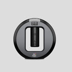 Black and gray electronic device with a digital display on a light gray background