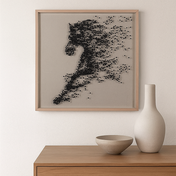 Framed abstract artwork of a horse on a wall above a wooden cabinet with decorative items.