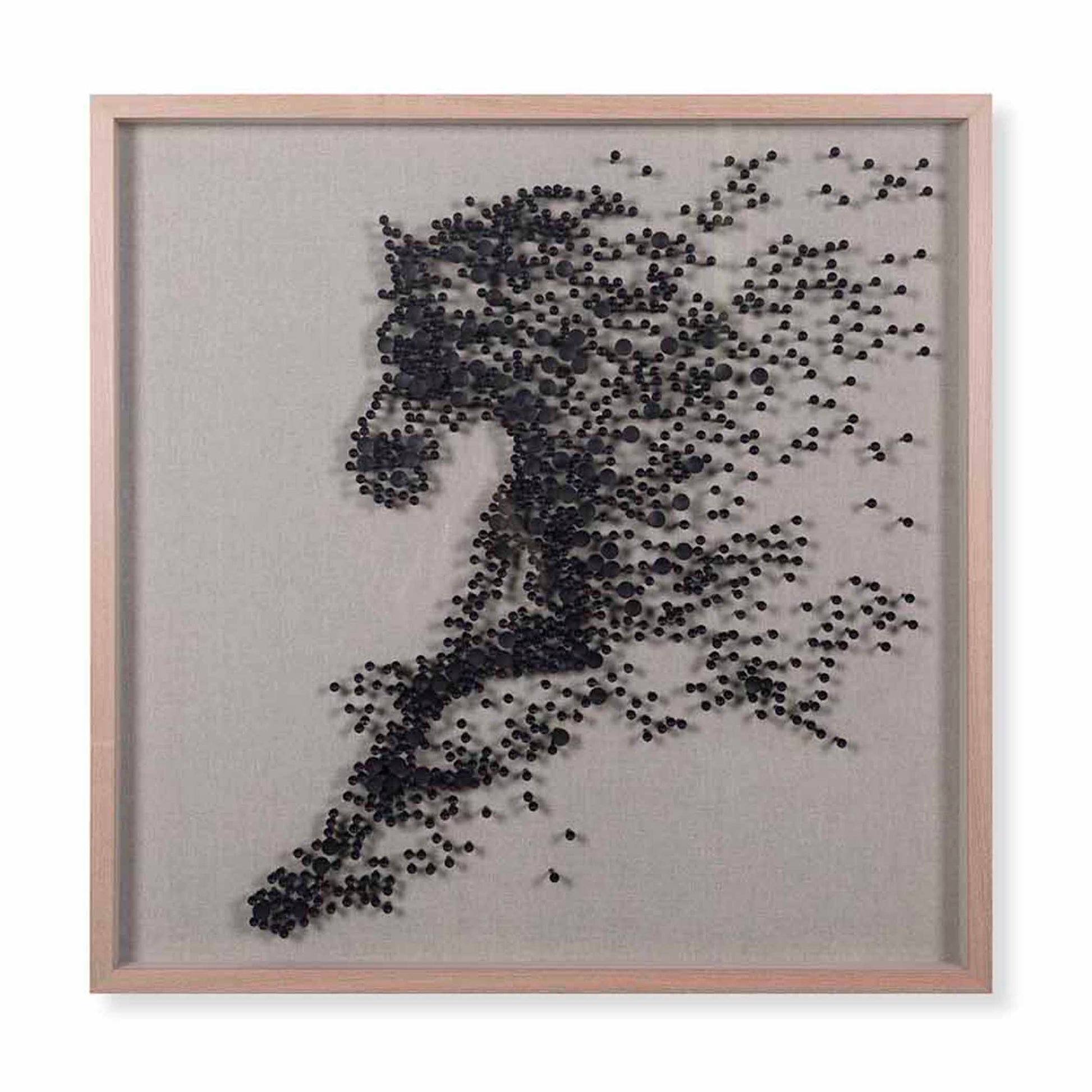 Framed artwork of a running person made from small black dots on a gray background