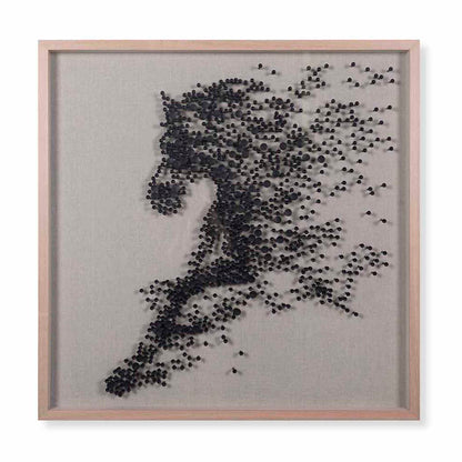 Framed artwork of a running person made from small black dots on a gray background