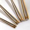Gold and silver metal handles on a white background- Kimora 16-Piece Cutlery Set – Gold & Chrome Finish