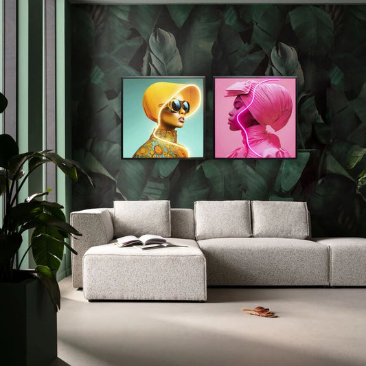 Modern living room with a gray sofa, decorative wall art, and green leafy plants.