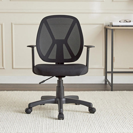 Black office chair in a room with a desk and decorative wall.