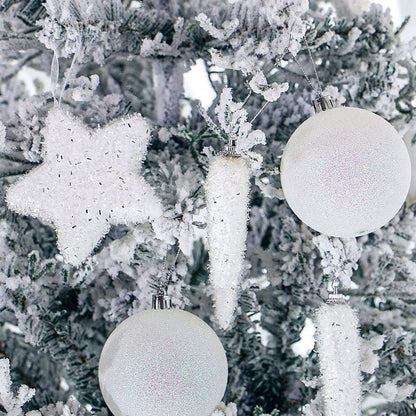 Decorative white ornaments on a frosted tree