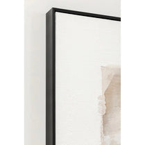 Framed abstract artwork with a black frame on a white wall