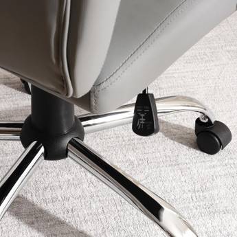 Close-up of office chair wheels on a carpeted floor