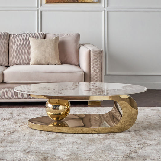 Gold coffee table with marble top in a living room setting