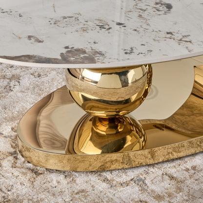 Decorative table with gold base and marble top on a textured surface