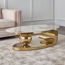 Gold coffee table with marble top in a living room setting