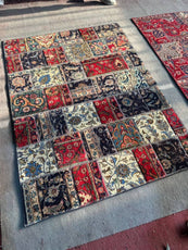 Patchwork rug with multicolored patterns on a concrete floor - Luxury Forty-pices carpet Handmade Persian Carpet | Handmade in Iran – Vintage | Luxury Living Room Décor