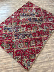 Decorative red patterned rug on a wooden floor- Luxury Forty-pices carpet Handmade Persian Carpet | Handmade in Iran – Vintage | Luxury Living Room Décor
