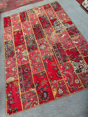 Decorative red rug with intricate patterns on a gray floor- Luxury Forty-pices carpet Handmade Persian Carpet | Handmade in Iran – Vintage | Luxury Living Room Décor